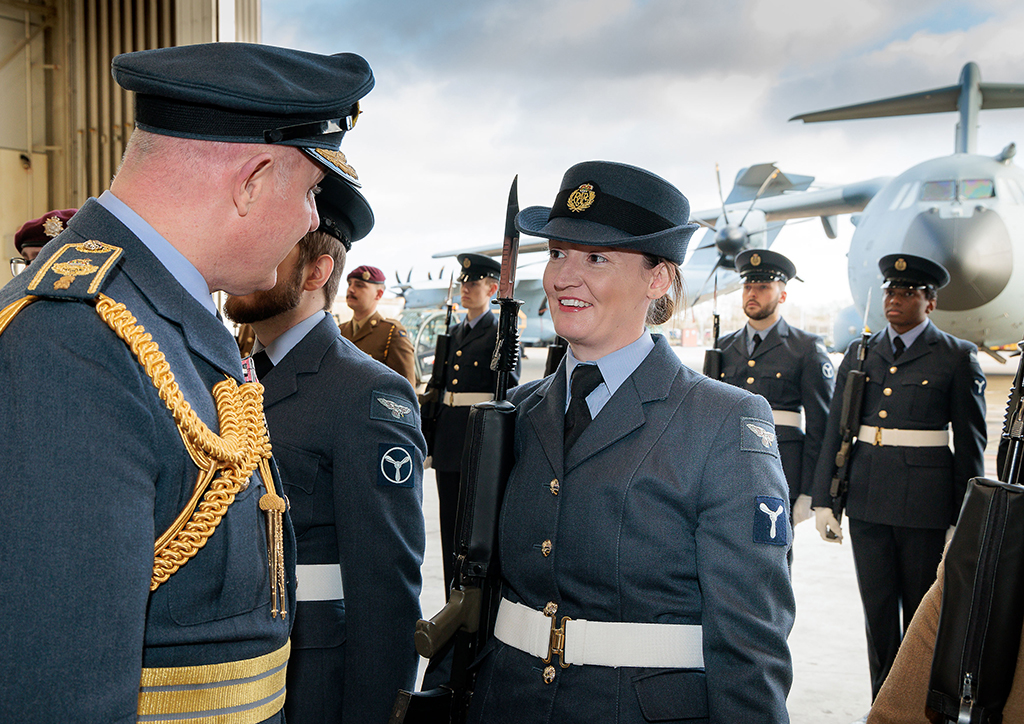 Chief of Air Staff, Air Chief Marshal Harv Smyth, talks with a RAF Brize Norton personnel, while reviewing the parade.